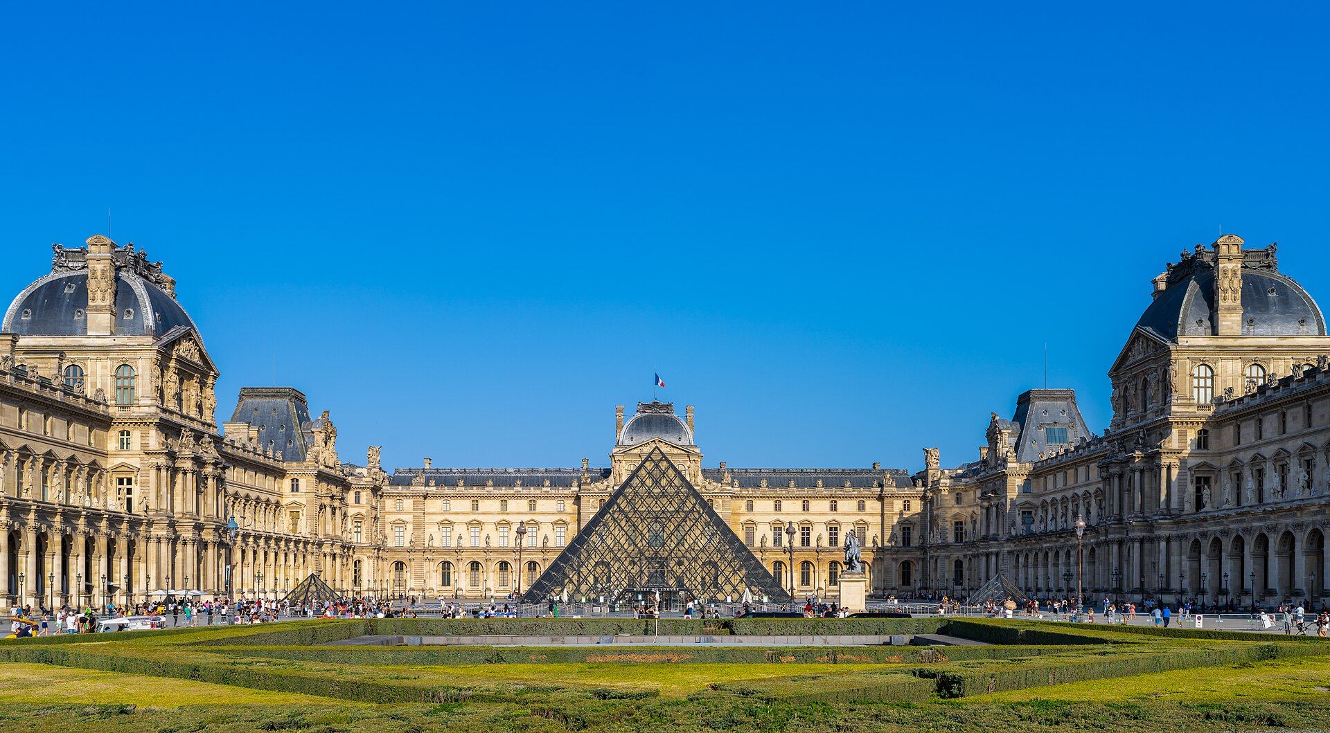 The glass pyramid of the Louvre; a photo of the district, not of the Drawing Hotel